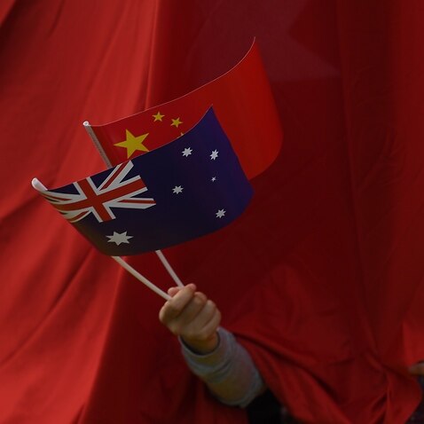 A file photo of the Chinese and Australian flags. 