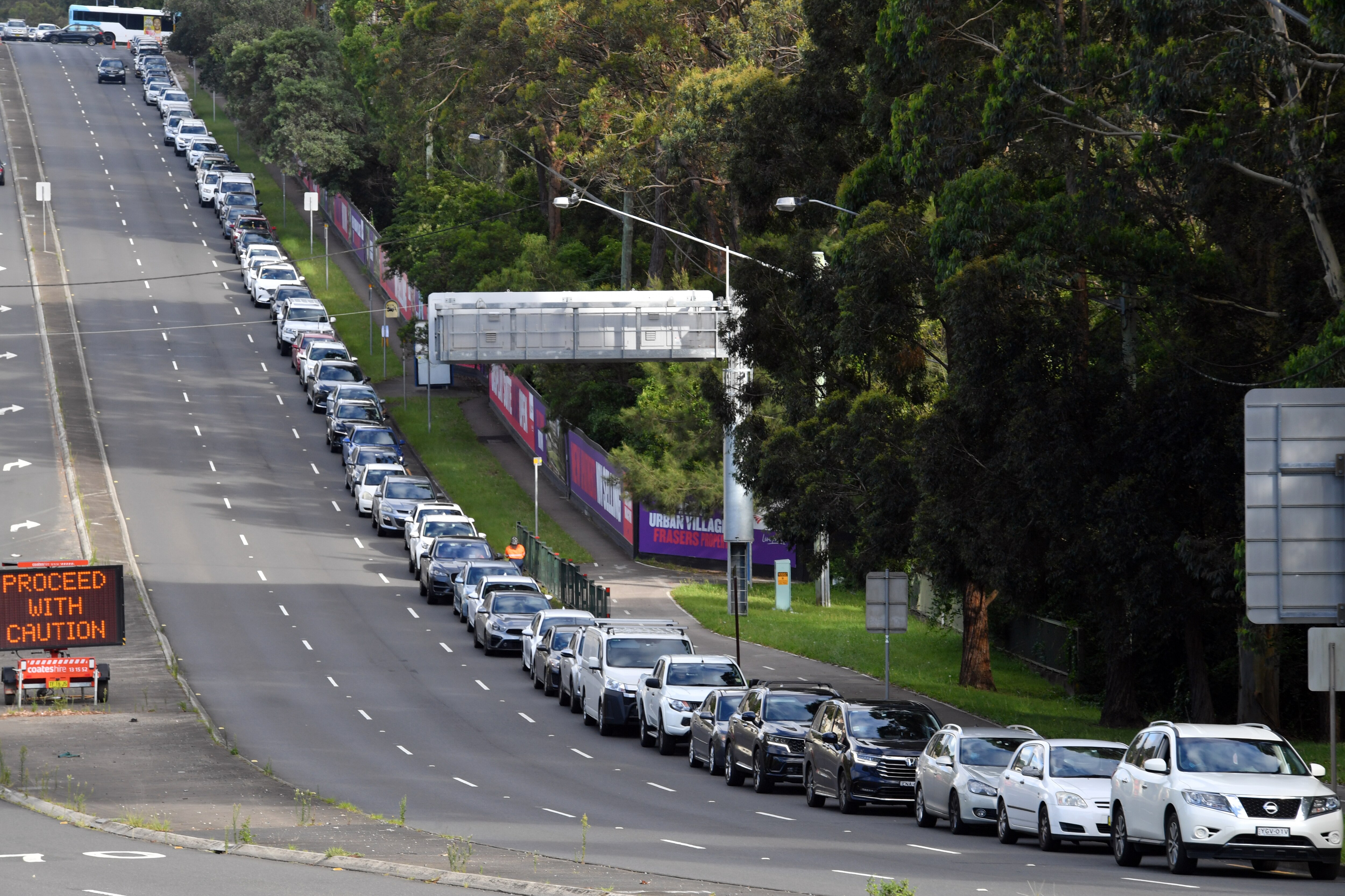 People line up for PCR tests at a clinic in North Ryde, Sydney, on Thursday, December 30, 2021.