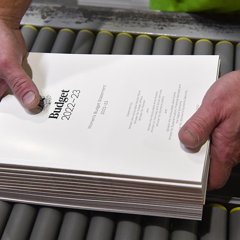 The 2022-2023 Budget Papers are seen at a printing facility prior to being delivered to Parliament House in Canberra, Sunday, March 27, 2022. (AAP Image/Mick Tsikas) NO ARCHIVING