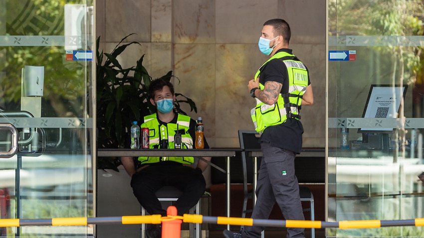 Security guards are seen at the Four Points Sheraton hotel in Perth, Sunday, 31 January, 2021.