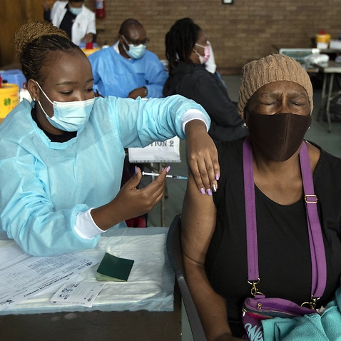 A woman receives vaccine jab in South Africa