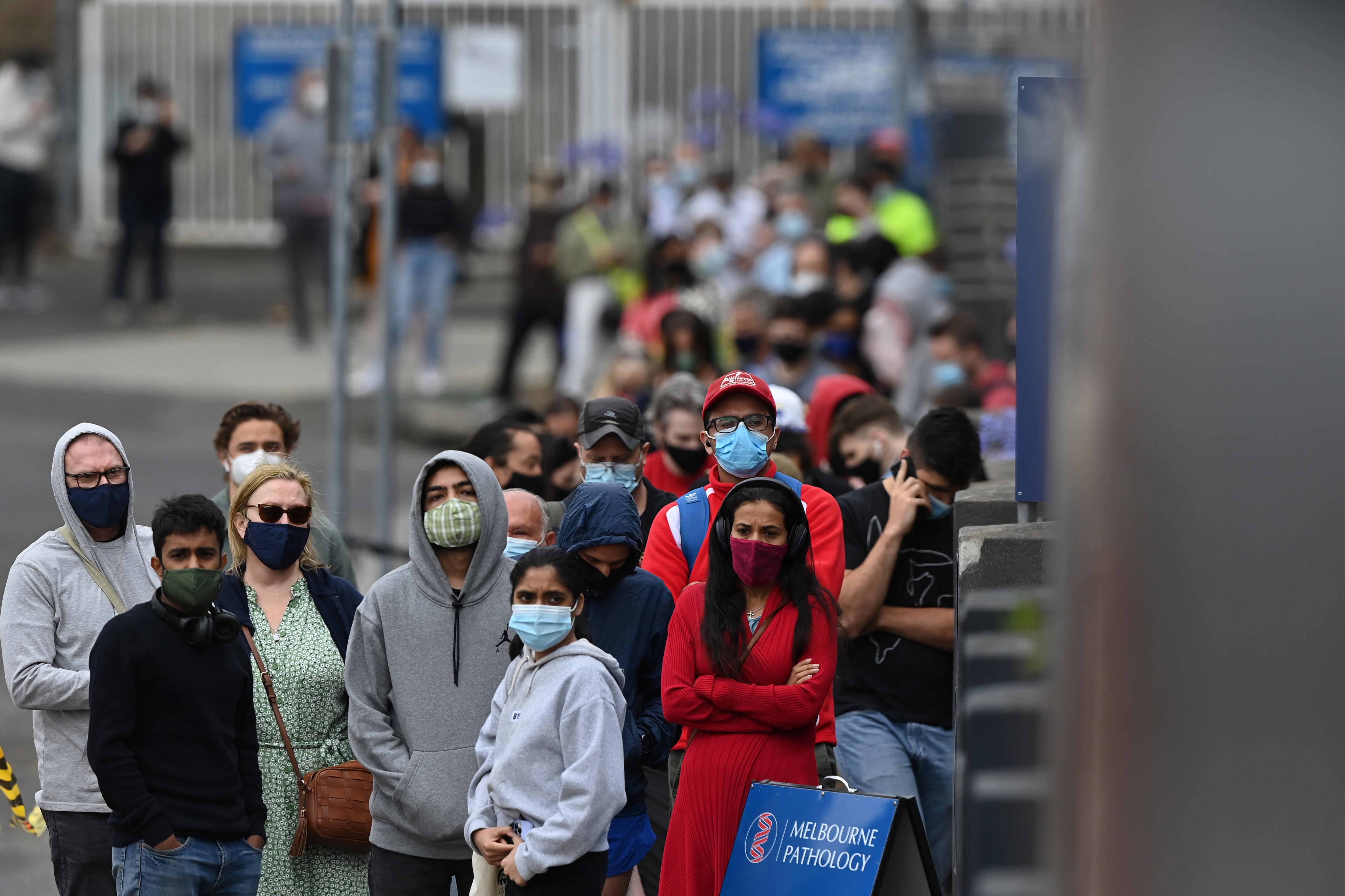 Members of the public wait to be tested at a pop up COVID clinic in Melbourne's North, Wednesday, December 22, 2021. Victoria is considering tightening indoor mask mandates, as testing sites continue to be inundated. (AAP Image/Joel Carrett) NO ARCHIVING