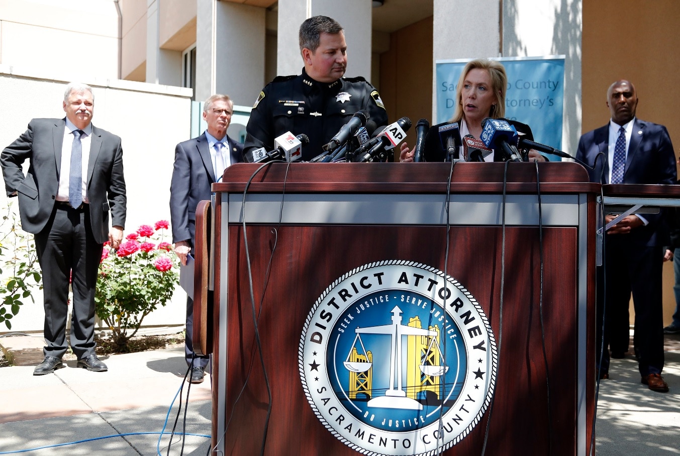 Sacramento District Attorney Anne Marie Schubert (2-R) responds to media questions as Sacramento County Sheriff Scott Jones (C) listens Sacramento District Attorney Anne Marie Schubert (2-R) responds to media questions as Sacramento County Sheriff Scott Jones (C) listens