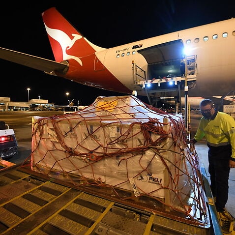 Pallets of vaccines being unloaded off Qantas flight after landing at Kingsford Smith International Airport on 5 September, 2021 in Sydney.