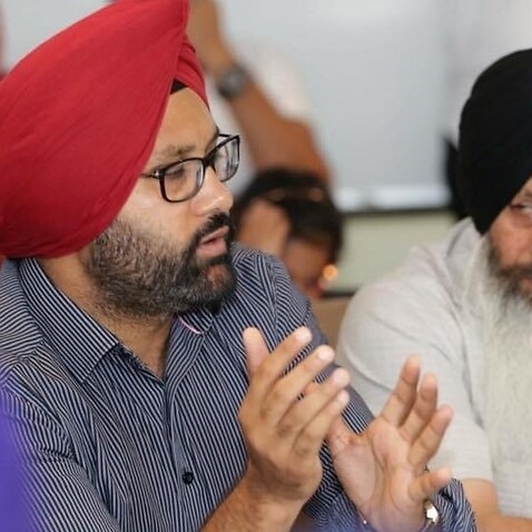 Judgebir Singh (left), at a community meeting in Melbourne