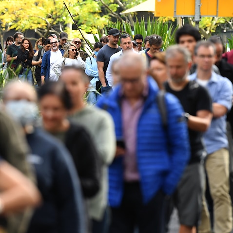 Members of the public wait in line at a mass COVID-19 vaccination hub in Sydney on Monday, 24 May, 2021.