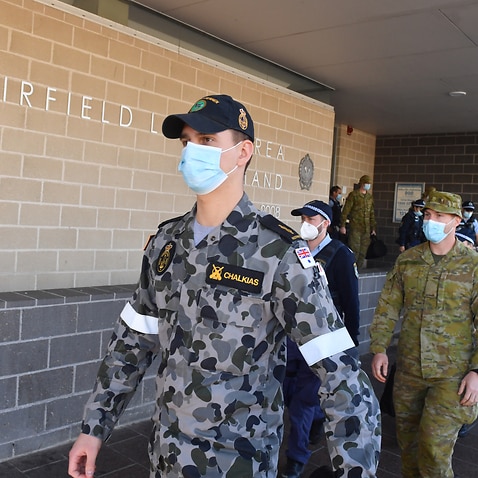 Australian Defence Force personnel and NSW police are seen being deployed from Fairfield Police Station in Sydney, Monday, August 2, 2021. 