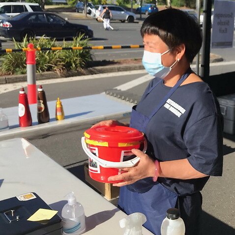 Wendy Lin Dong-wen helps CFA raise funds by selling snags at Bunnings