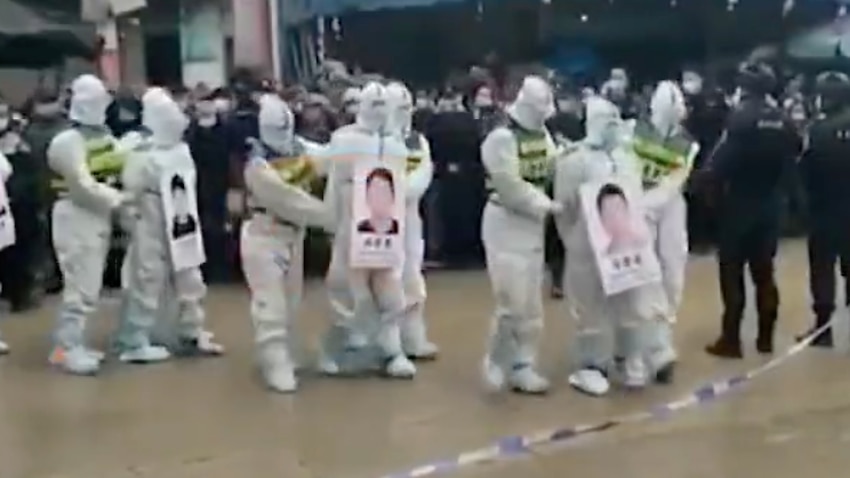 Image for read more article 'Alleged COVID-19 rule-breakers in China paraded through the street in public shaming exercise'