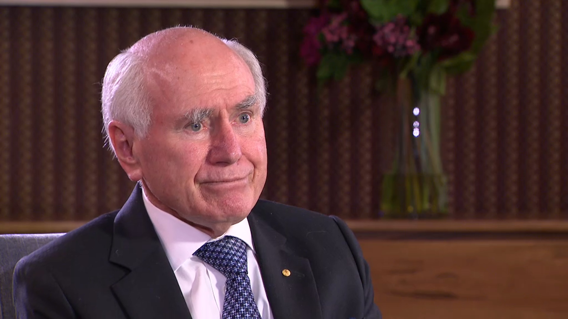 John Howard says it's not 'racist' to cut Australia's ...