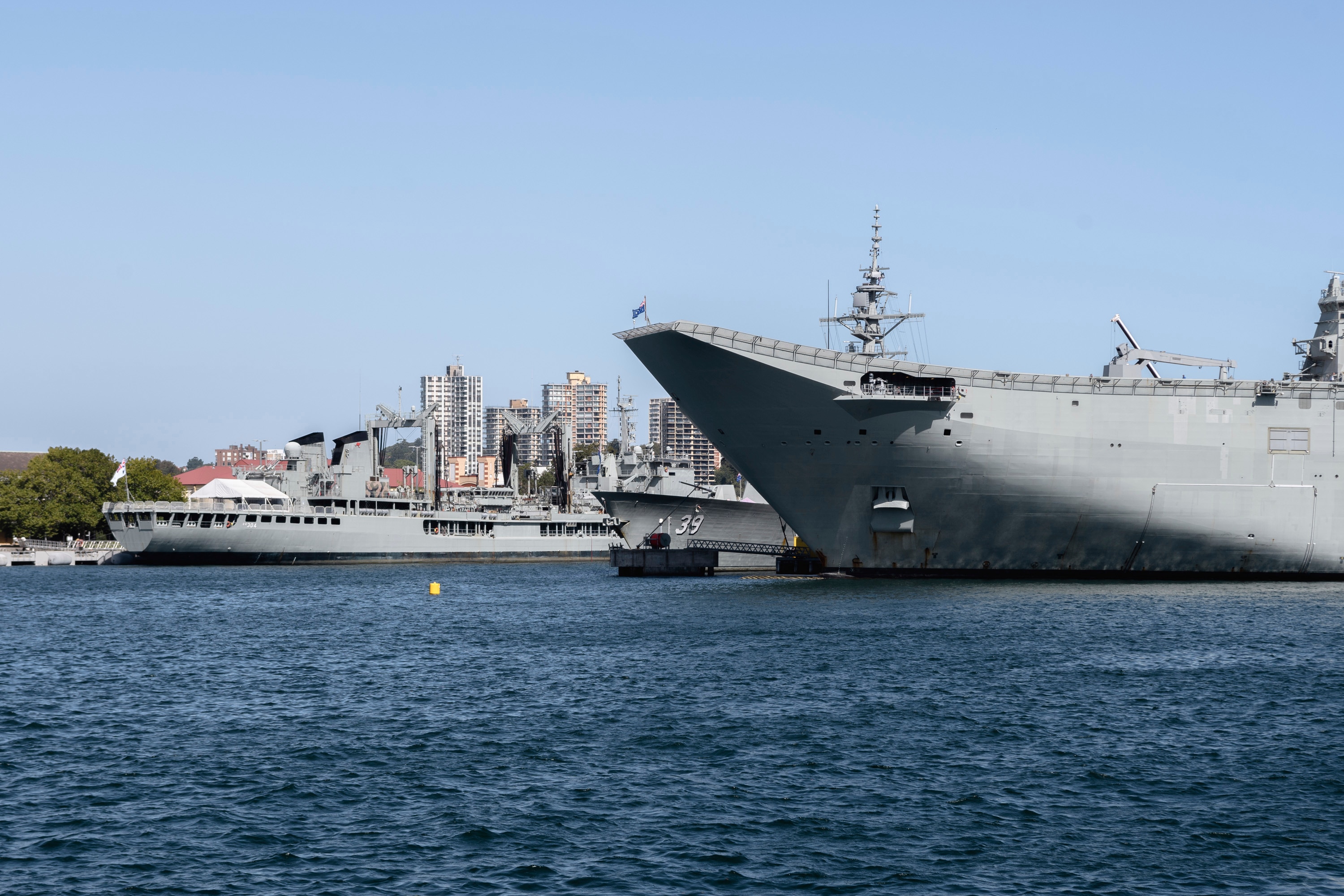  - Ships HMAS Success (OR 304), HMAS Hobart (DDG 39) and HMAS Canberra (L02) are seen docked in port in Sydney, Australia, on 23rd February 2019, in archival photo. Australia, the United Kingdom and the United States announced a new military pact, the AUK