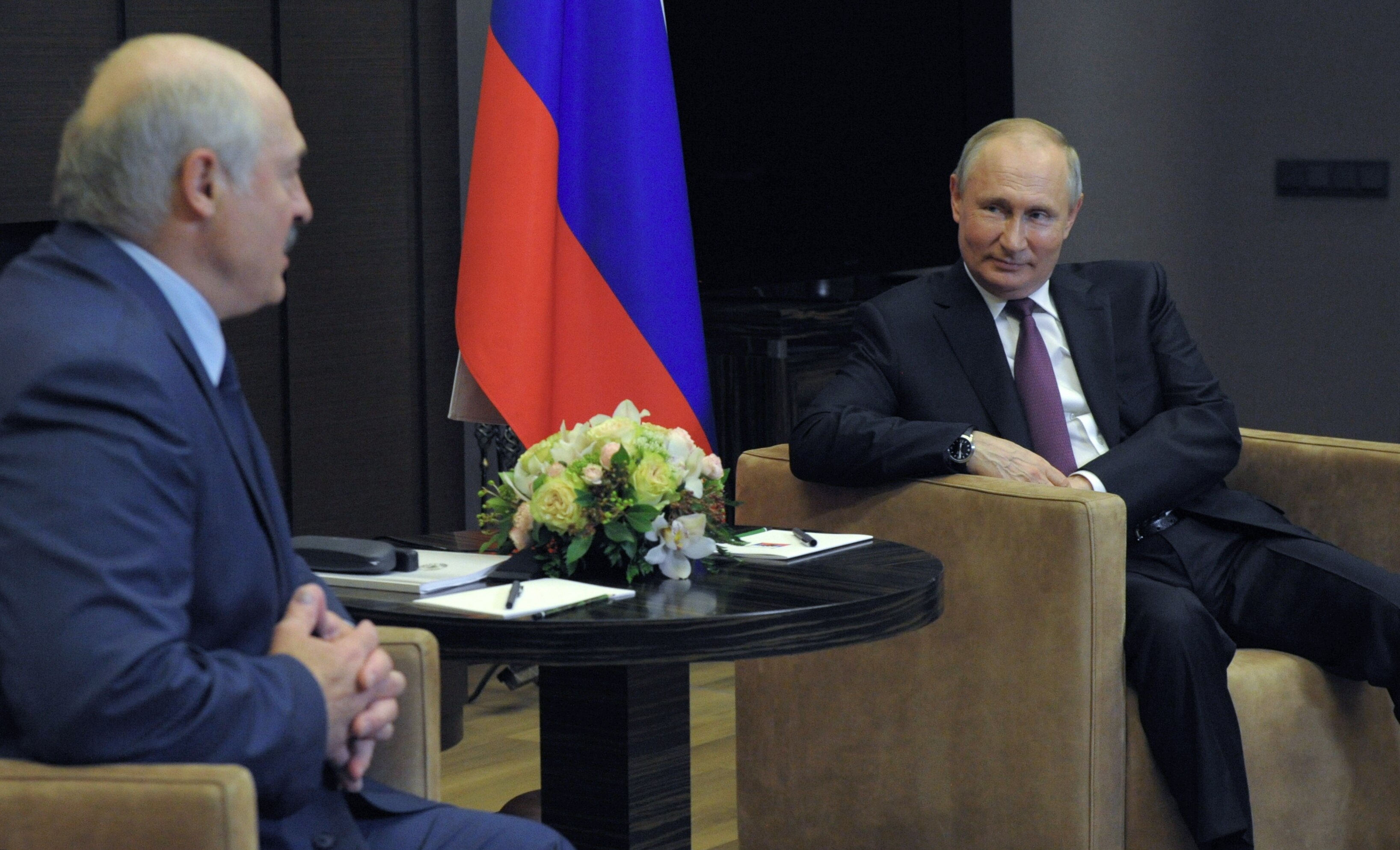 Russian President Vladimir Putin (right) speaks with Belarusian President Alexander Lukashenko.