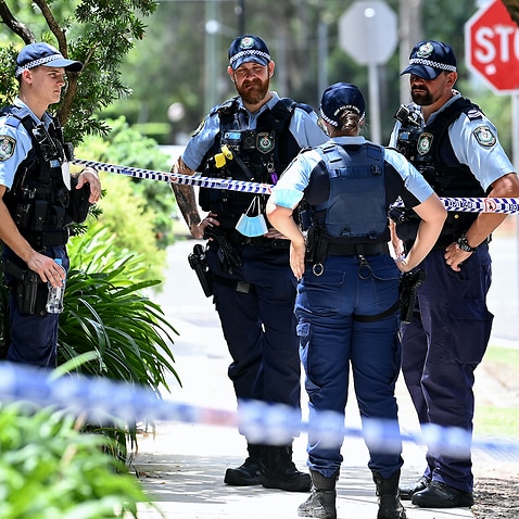 NSW Police officers at the scene where a woman was found dead inside an apartment at North Parramatta, Sydney, 31 January, 2022. 
