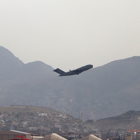 A US military aircraft takes off from the Hamid Karzai International Airport in Kabul, Afghanistan