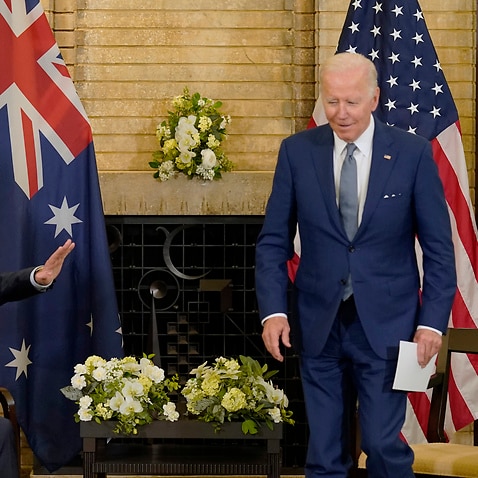President Joe Biden, right, jokes with Australian Prime Minister Anthony Albanese during the Quad leaders summit meeting at Kantei Palace, Tuesday, May 24, 2022, in Tokyo. (AP Photo/Evan Vucci)
