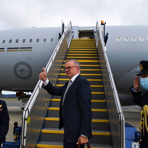 Australian Prime Minister Anthony Albanese boards the plane to Japan to attend the QUAD leaders meeting in Tokyo, Canberra, Monday, May 23, 2022. (AAP Image/Lukas Coch) NO ARCHIVING