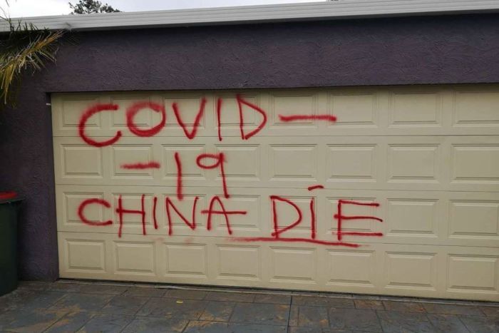 A racist slur spray painted on the garage door of a Chinese-Australian family in Melbourne.