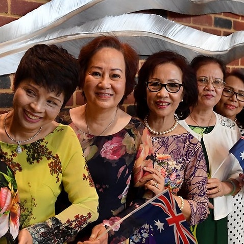 Vietnamese migrants at a multicultural event near Perth. Migrants in our survey who assimilated to Australian culture reported having higher personal well-being than those who didn’t. 
