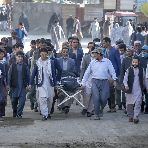 People attend the funeral of one of the victims of an attack that targeted a school  in the west of Kabul, Afghanistan, 9 May 2021.