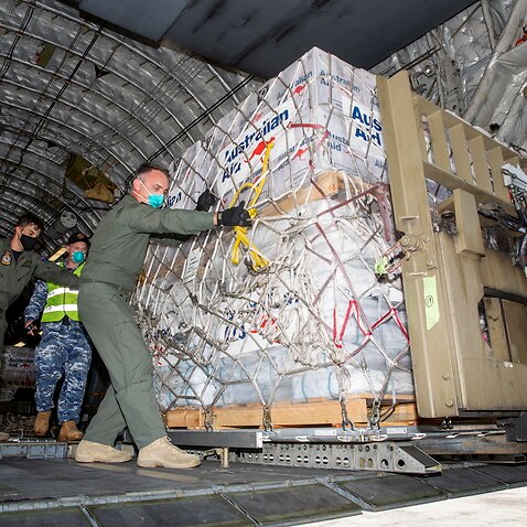 Air Movements Operators unload humanitarian assistance and engineering equipment at Fua'amotu International Airport in Tonga.