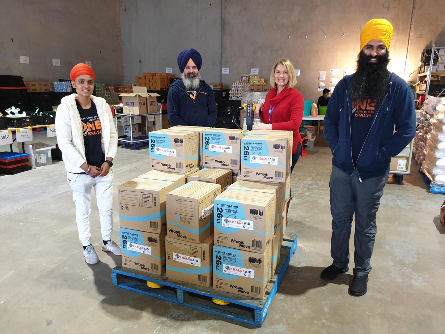 Khalsa Aid volunteers getting ready to distribute free grocery items. 