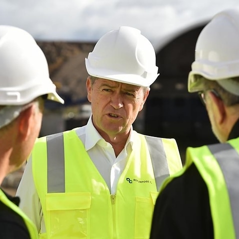 Federal Opposition Leader Bill Shorten (centre) in a hard hat.