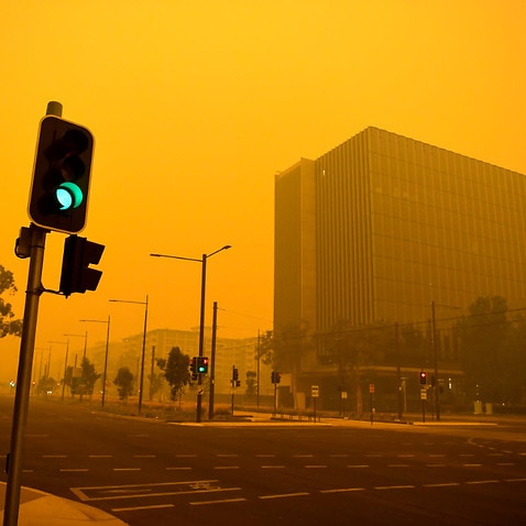 Empty streets are seen as smoke haze impacts the city centre early morning in Canberra, Sunday, 5 January, 2020.