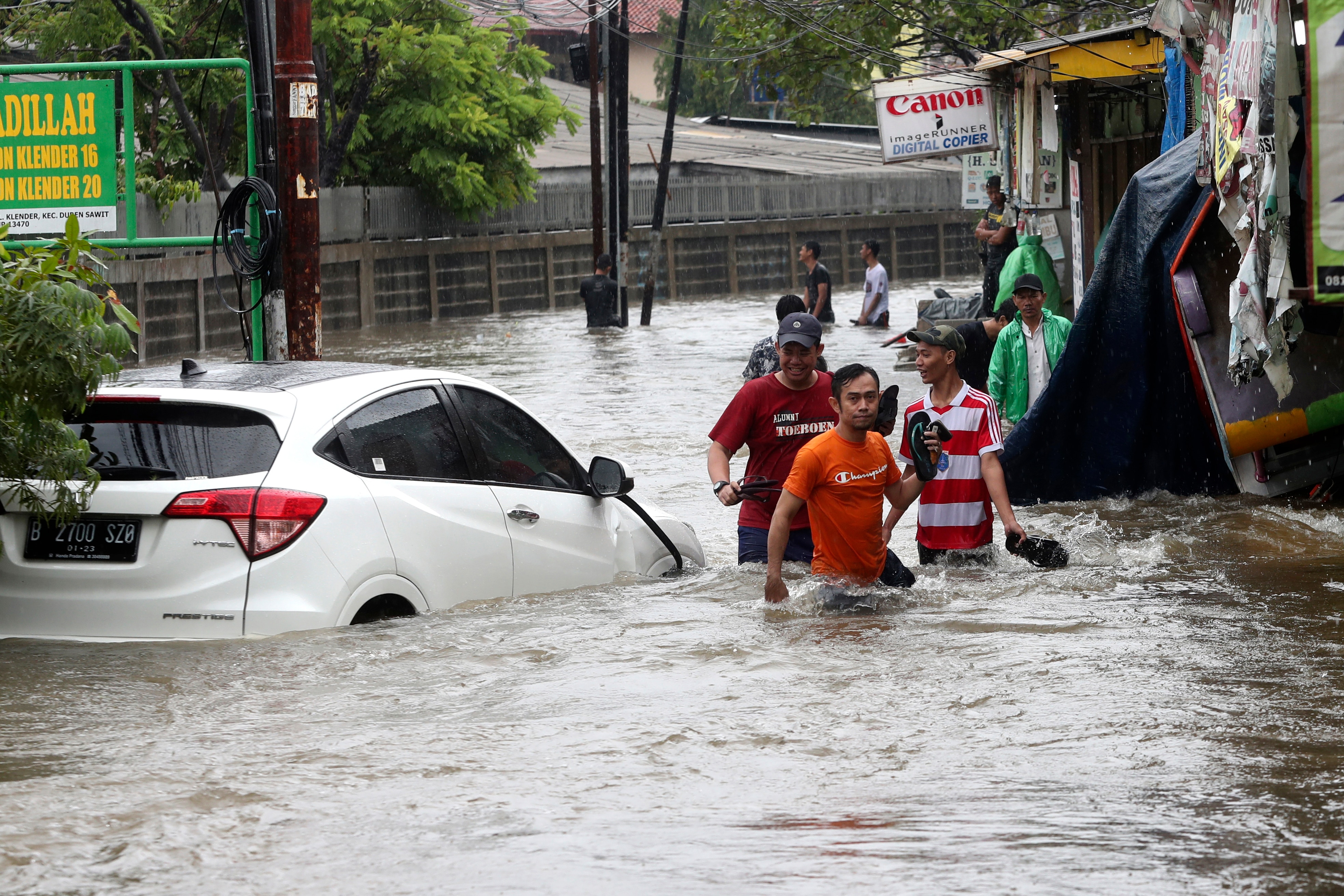 Indonesia floods leave two dozen dead several missing 