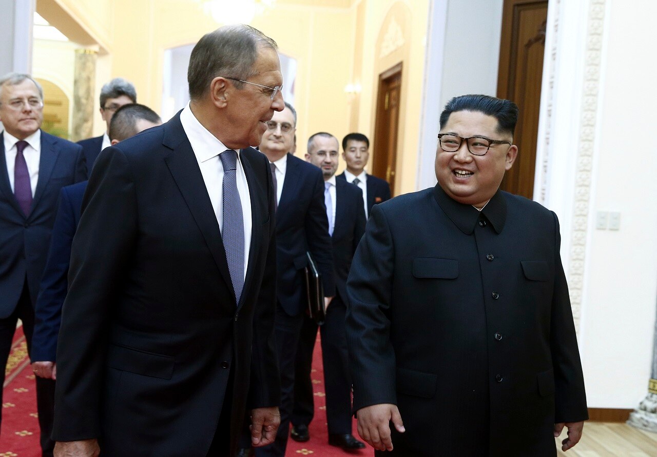 Kim Jong-un and Russia's Foreign Minister Sergei Lavrov talk to each other during a meeting in Pyongyang, North Korea.