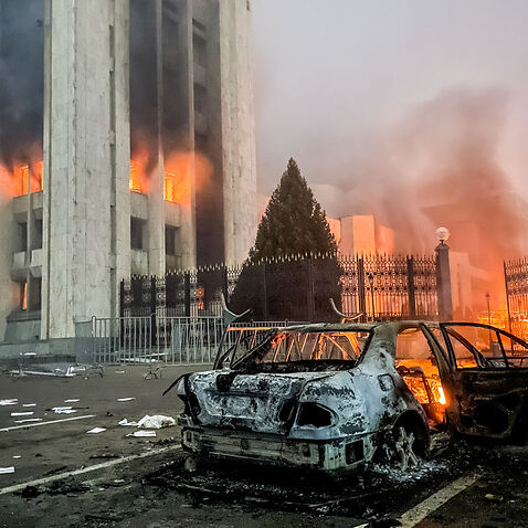 A burnt car is seen by the Almaty mayor's office on 5 January 2022