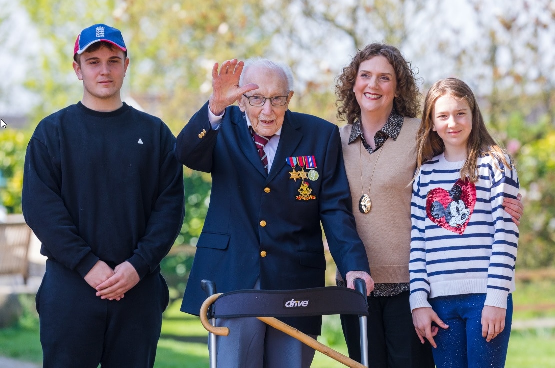 99-year-old British veteran Captain Tom Moore (2-L) with grandson Benji (L), daughter Hannah Ingram-Moore (2-R) and granddaughter Georgia (R).