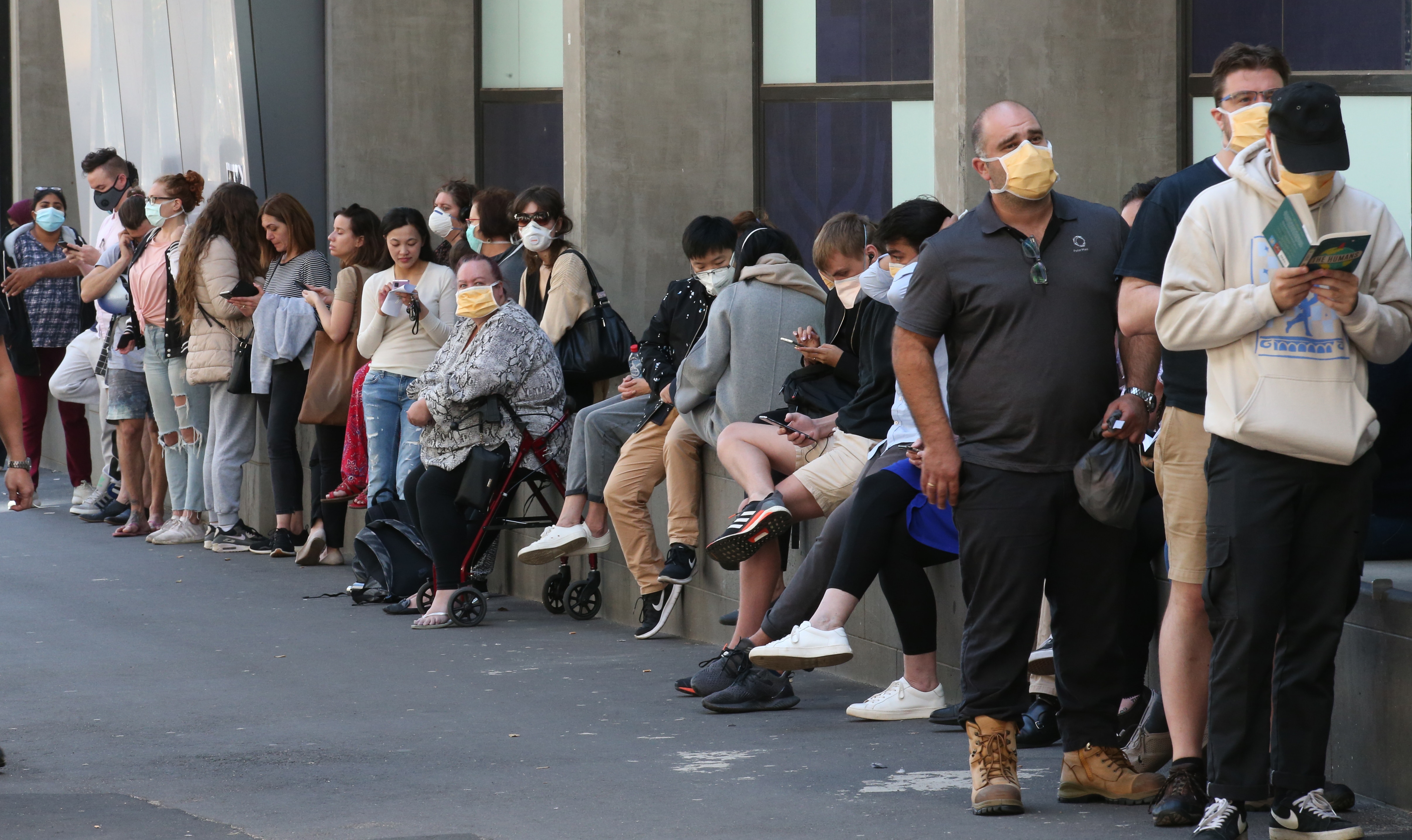 Patients line up at the Royal Melbourne Hospital for coronavirus testing. 