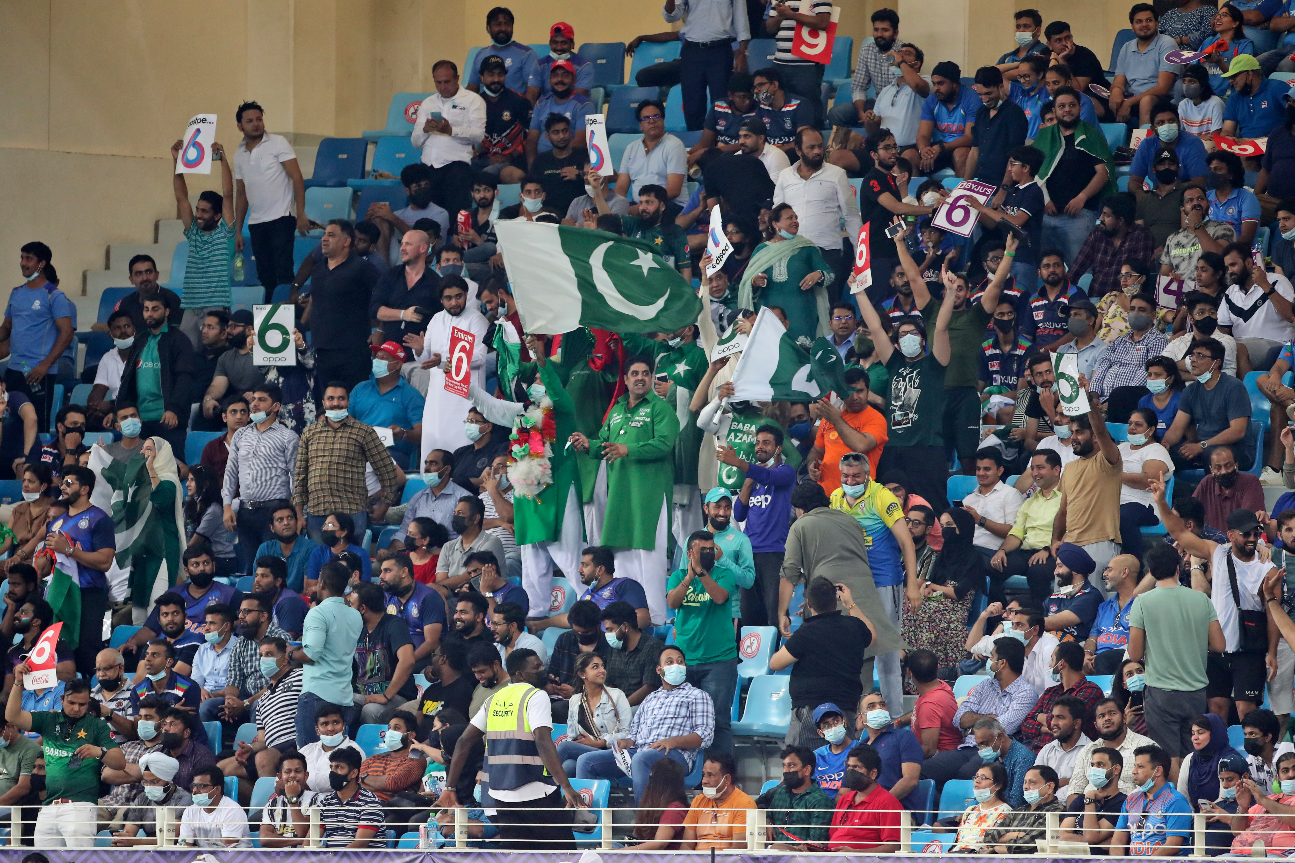 Pakistan's cricket fans celebrate a six by captain Babar Azam during the Cricket Twenty20 World Cup match between India and Pakistan in Dubai, UAE, Sunday, Oct. 24, 2021. (AP Photo/Aijaz Rahi)