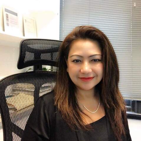 Thanawan Rochanavedya, a Thai migration agent in her office
