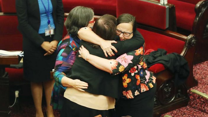 Victorian Upper House MPs hug after the voluntary assisted dying bill passed in November 2017.