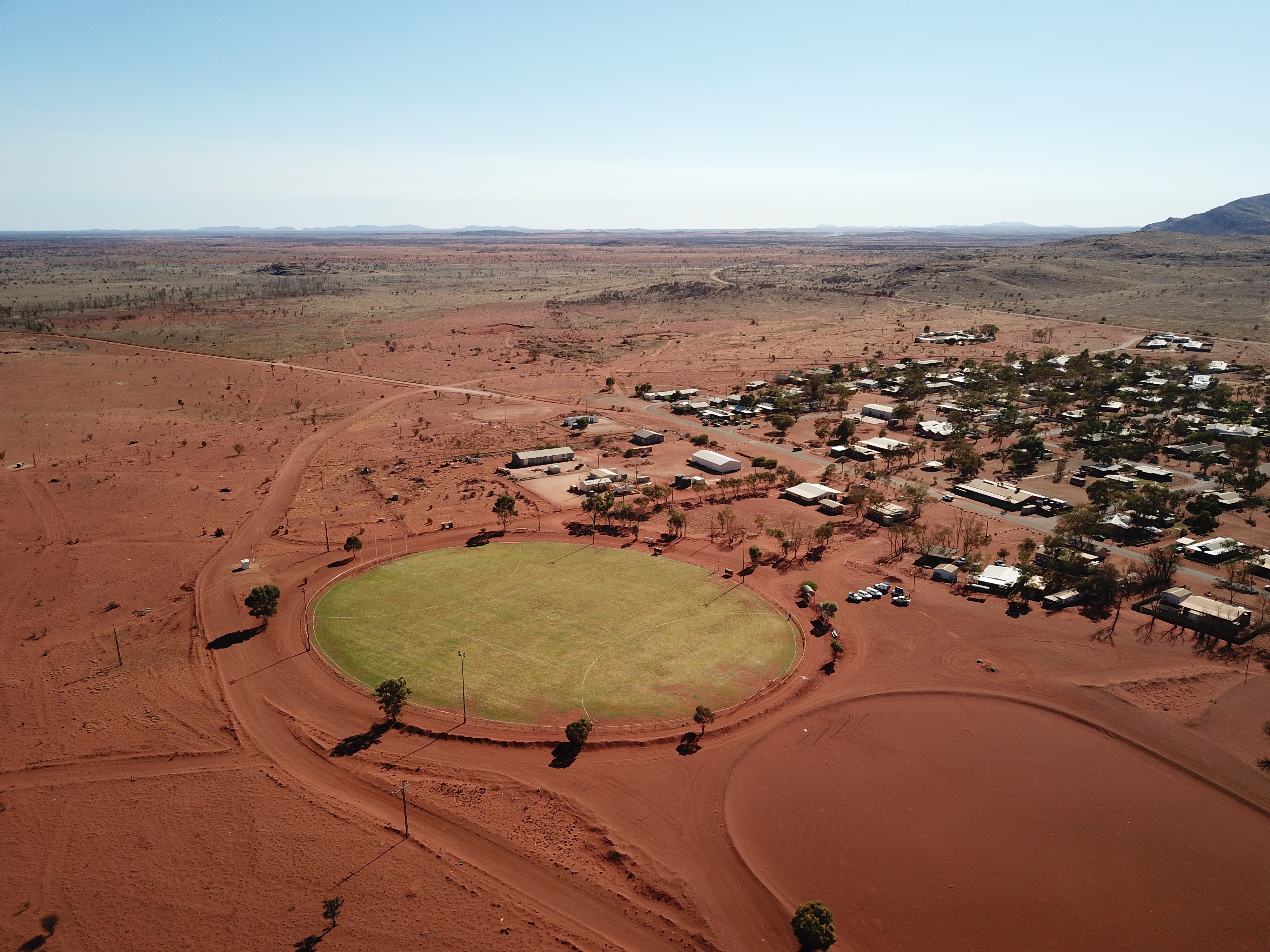 The new grass community oval at Amata is uniting the desert town. 
