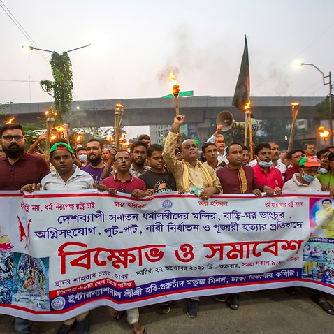 Bangladeshi Hindu community members join torch procession blocking Shahabagh road during a protest against communal attackBangladesh, 22 October 2021.