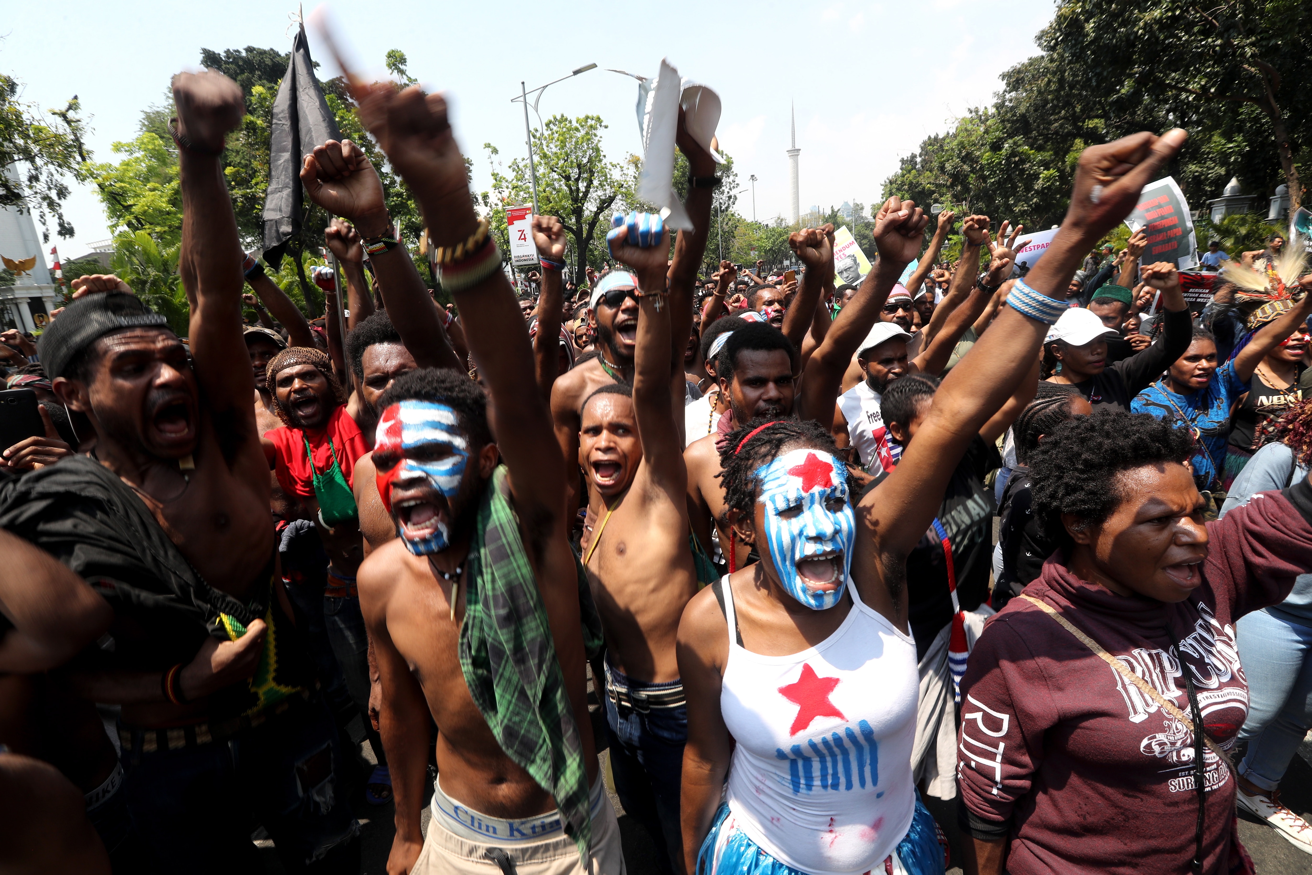 Papuan activists shout slogans during a rally in Jakarta, Indonesia, 22 August 2019.