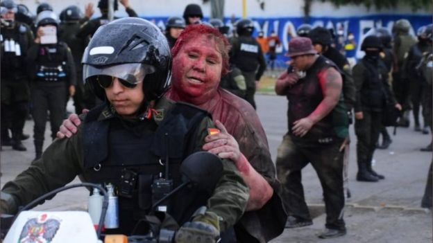 Image result for Bolivia: Protesters cut off mayor’s hair, cover her in red paint and drag her through the streets
