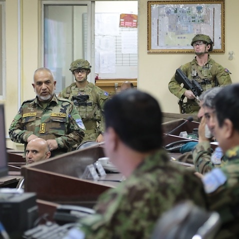Officers talk in the KGC Joint Operations Command room