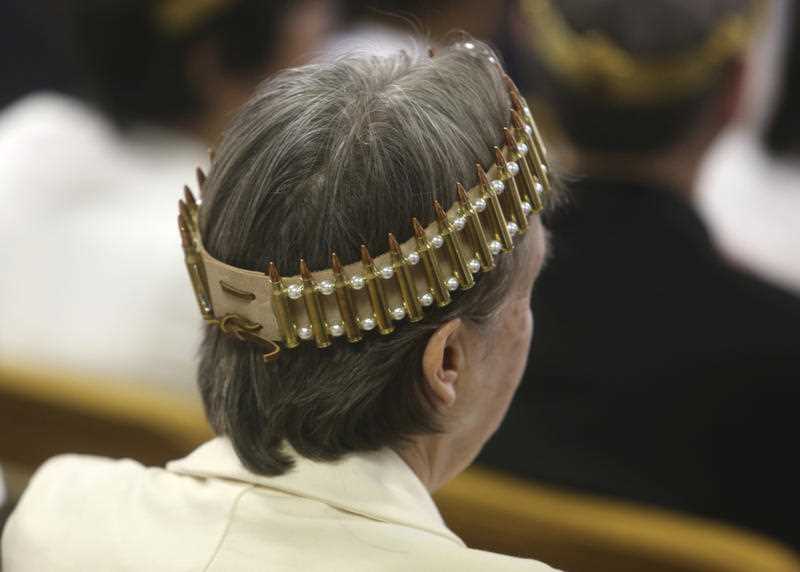 A woman wears a crown made of ammunition during services at the World Peace and Unification Sanctuary in Newfoundland, Pennsylvania