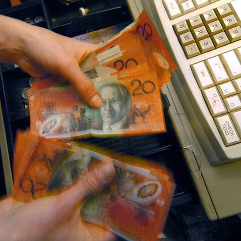 Money removed from a till Canberra, Thursday, July 12,  2007.  (AAP Image/Alan Porritt) NO ARCHIVING