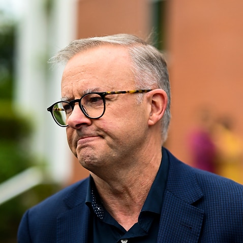 Australian Opposition Leader Anthony Albanese speaks to the media clarifying an earlier answer after attending the Easter Sunday mass at St. Monicas on Day 7 of the 2022 federal election campaign, in Cairns, Sunday, April 17, 2022. (AAP Image/Lukas Coch) 
