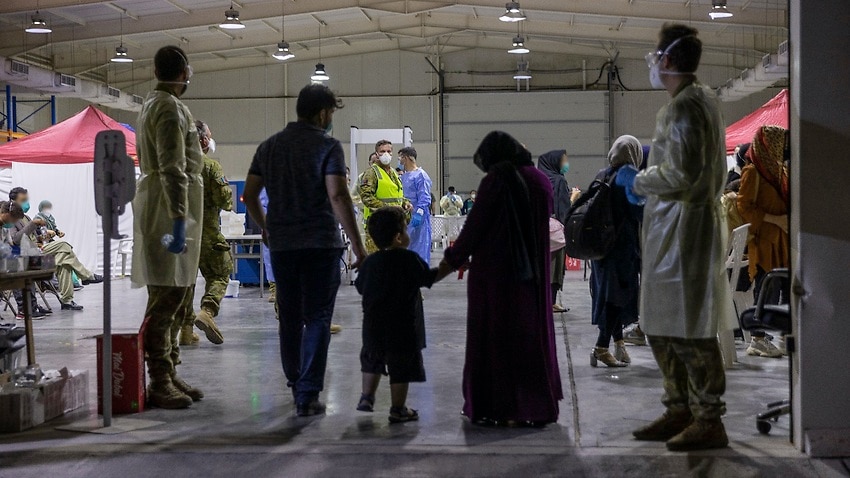 Afghans are evacuated from Kabul in August 2021 as part of an operation by the Australian Defence Force.
