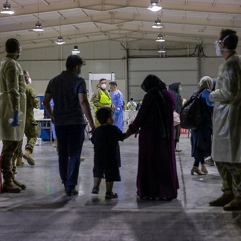 Afghans are evacuated from Kabul in August 2021 as part of an operation by the Australian Defence Force. 