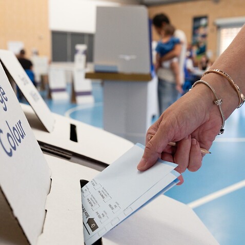 A member of the public casts their vote at a polling station in West Byford, Perth