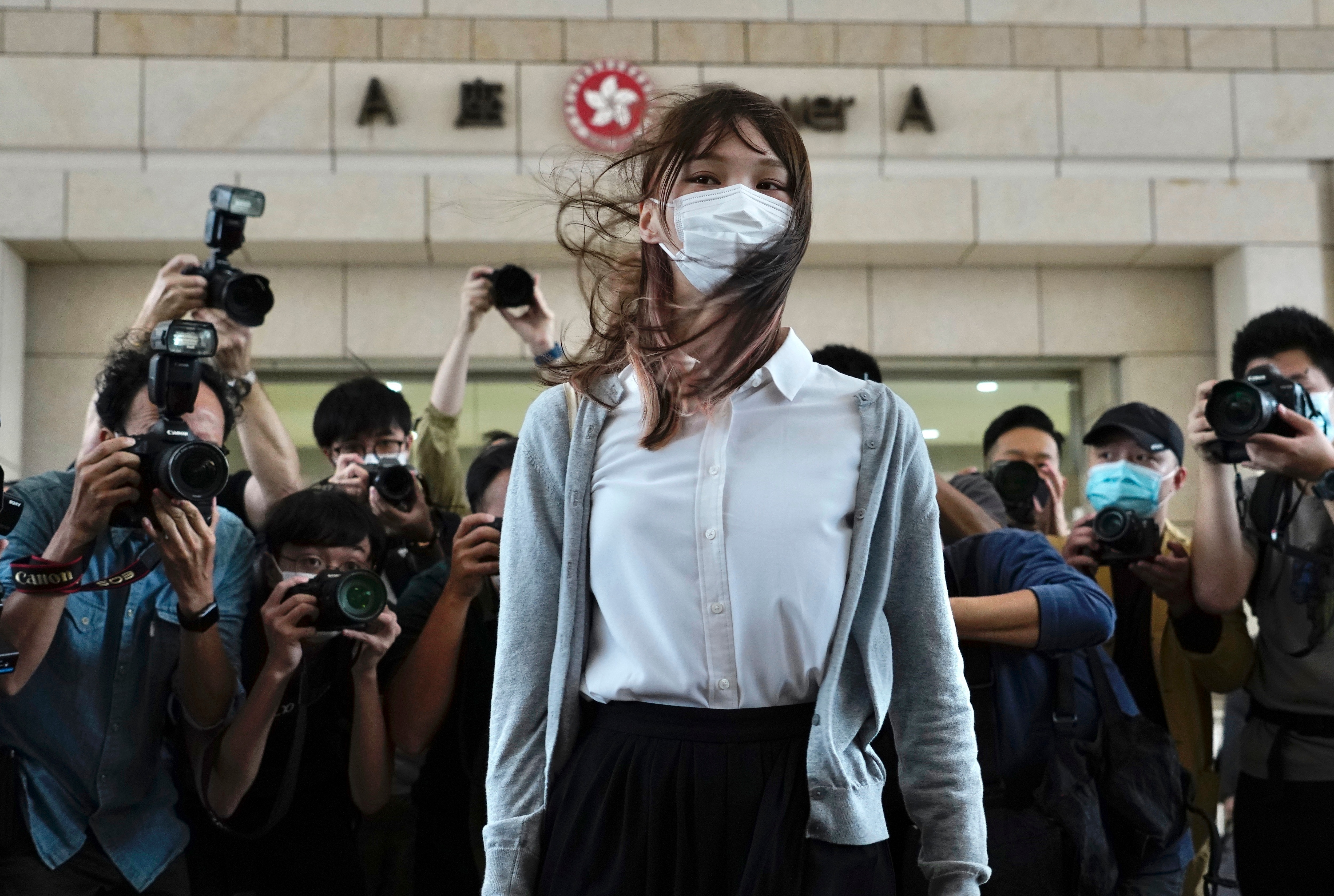 Hong Kong activist Agnes Chow arrives at a court in Hong Kong, Monday, Nov. 23, 2020. 