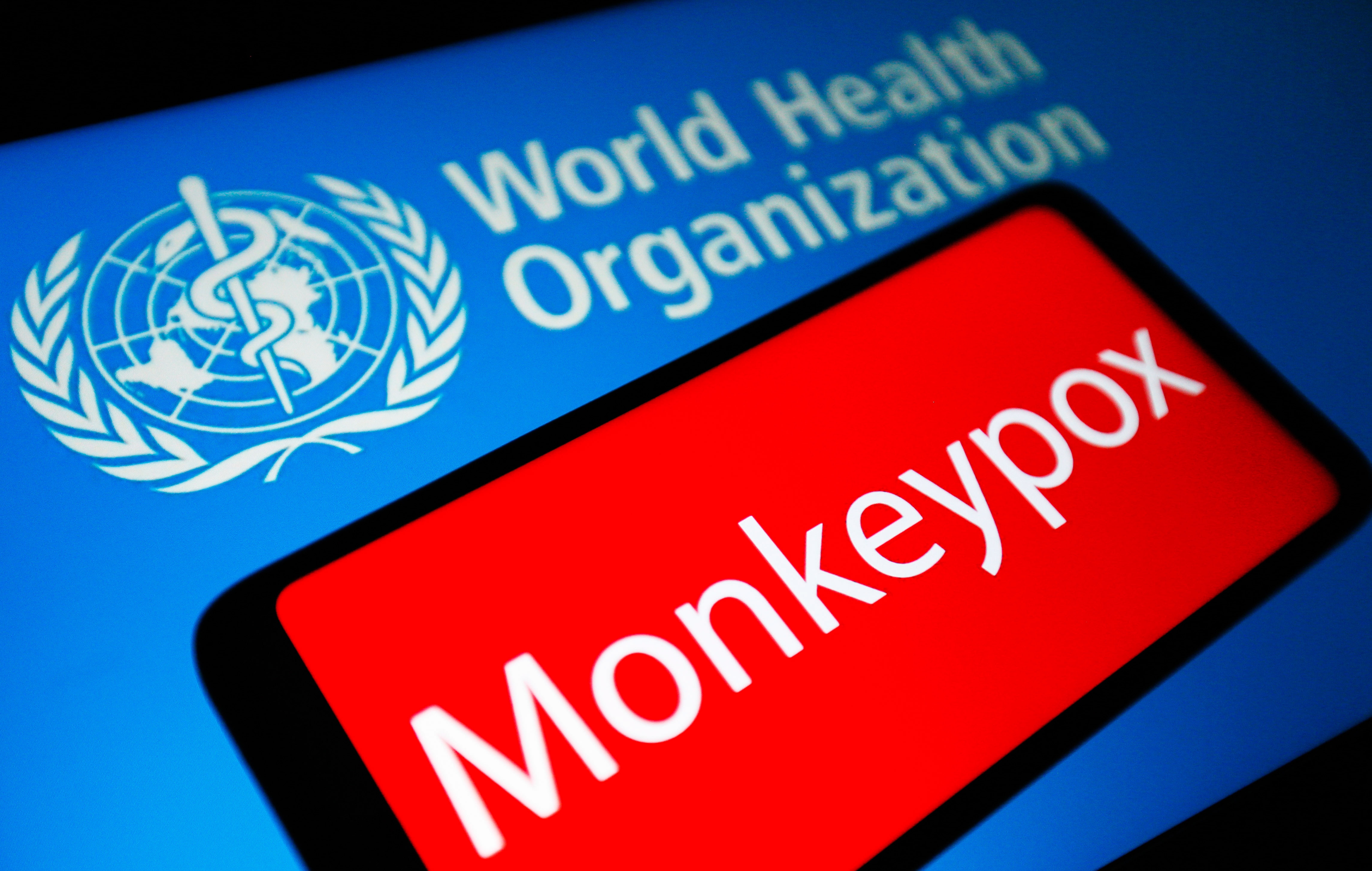 In this photo illustration, Monkeypox word is seen on the screen of a smartphone and the World Health Organization (WHO) logo in the background. (Photo by Pavlo Gonchar / SOPA Images/Sipa USA)