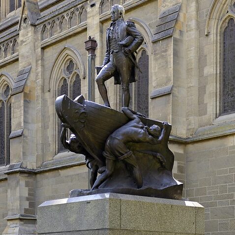 Bronze statue of Captain Matthew Flinders, at St Paul's cathedral in the city of Melbourne, Australia