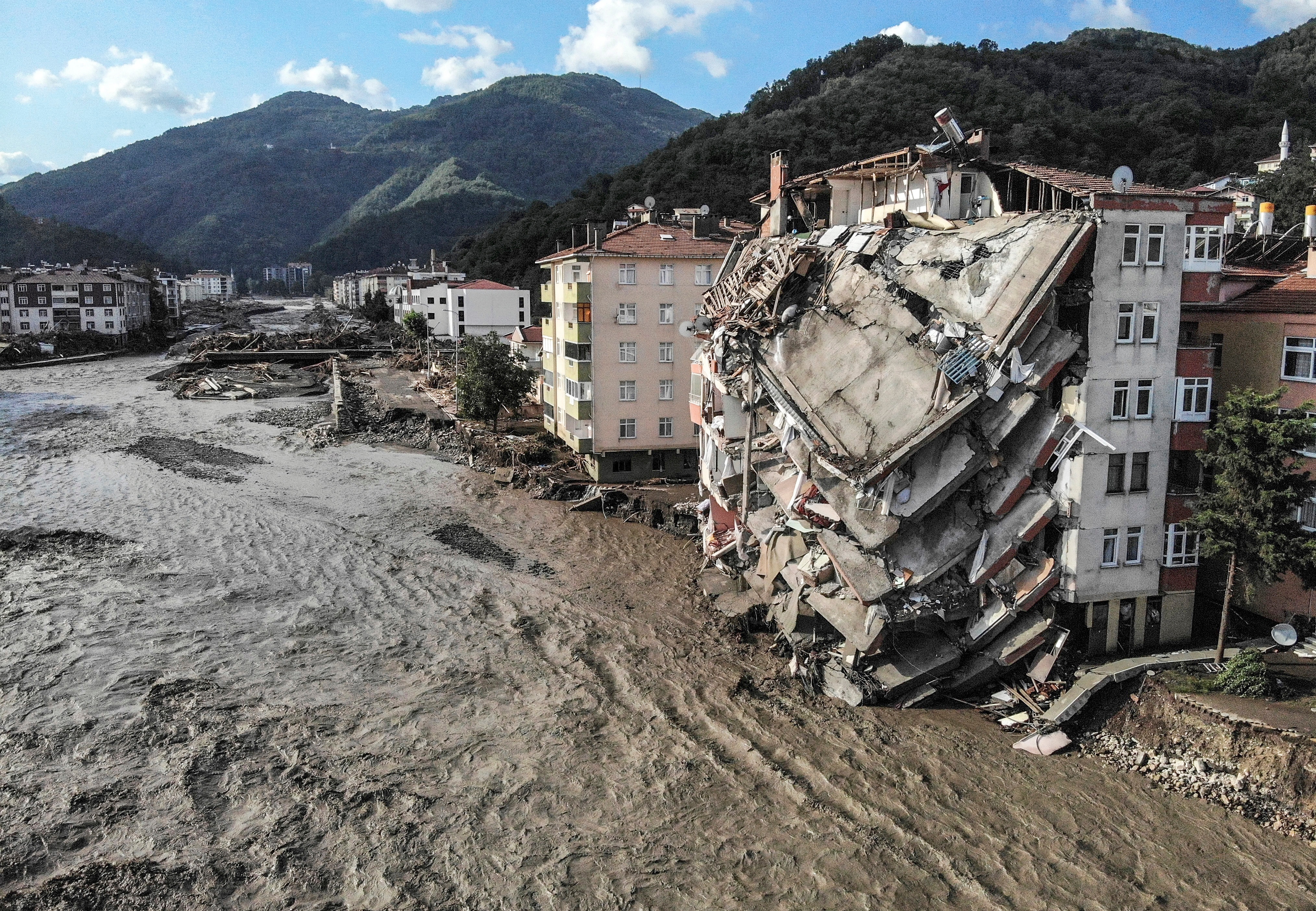 An aerial photo shows destroyed buildings after floods and mudslides in Bozkurt, Kastamonu province, Friday, Aug. 13, 2021. 